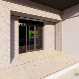 EK PROJEKT EWELINA KRAMARZ - Elewacja domu z jasnej cegły z ciemnobrązowymi drzwiami balkonowymi i małym oknem. Widoczny fragment tarasu z jasnych płyt.