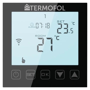 Czarny panel sterowania TERMOFOL z wyświetlaczem LCD pokazującym temperaturę w pomieszczeniu 27 stopni Celsjusza, ustawioną temperaturę 23.5 stopnia Celsjusza i godzinę 07:18. Widoczne ikony Wi-Fi...