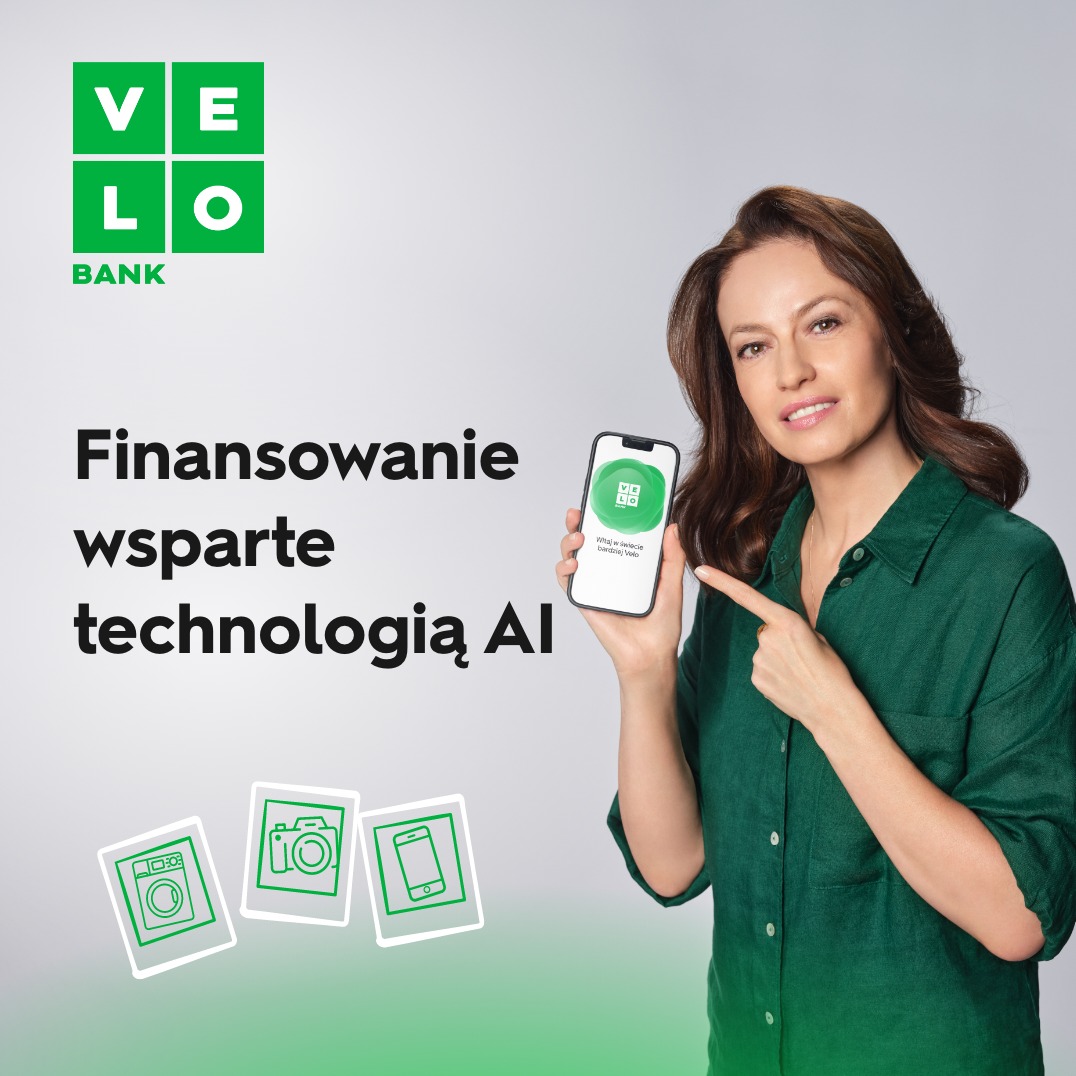 Kobieta w zielonej koszuli prezentuje smartfon z logo banku Velo i napisem 'Finansowanie wsparte technologią AI', poniżej grafiki pralki, aparatu i telefonu.