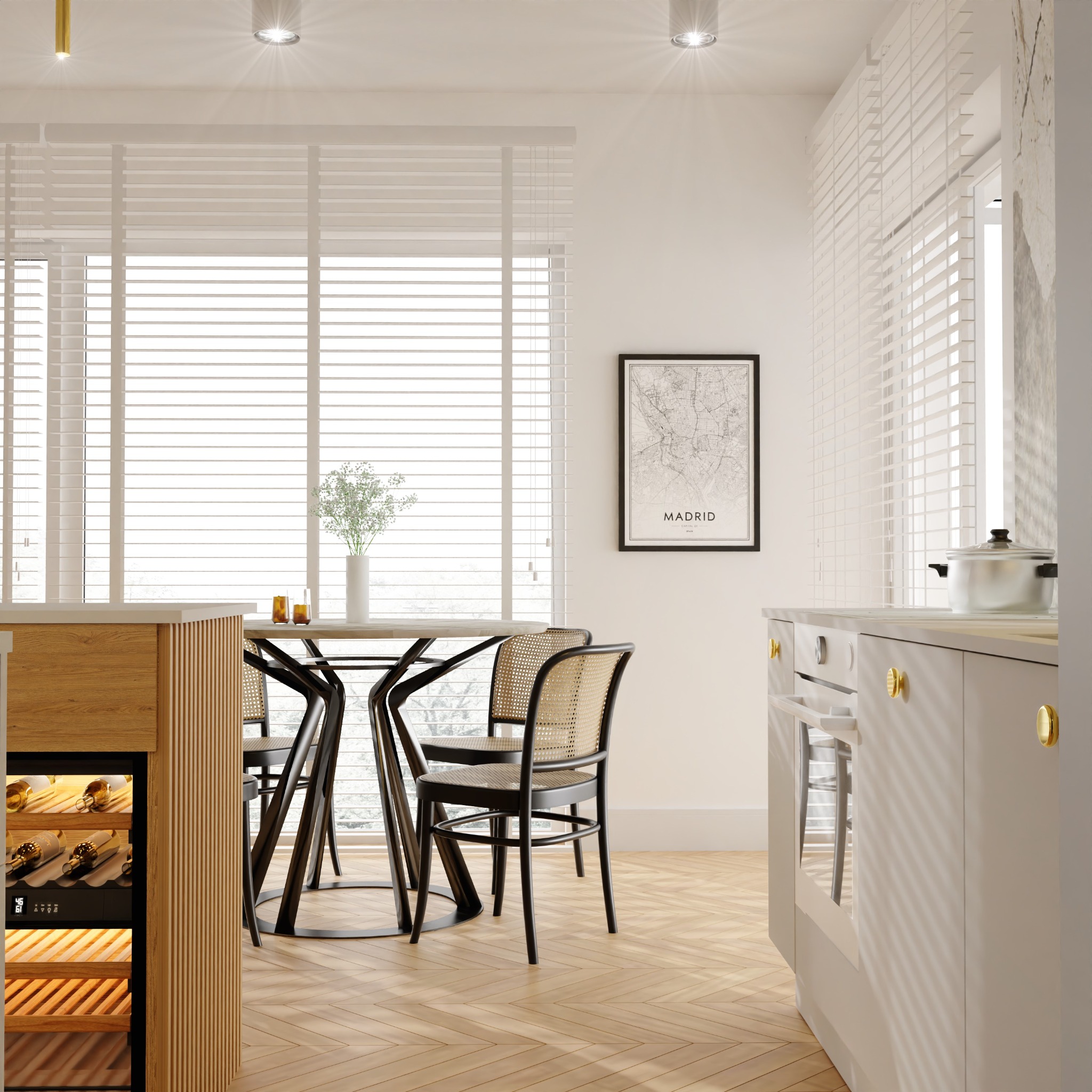 Jasna kuchnia w Szczecinie z drewnianą podłogą w jodełkę, okrągłym stołem i krzesłami z rattanu. Na ścianie mapa Madrytu w czarnej ramie.
