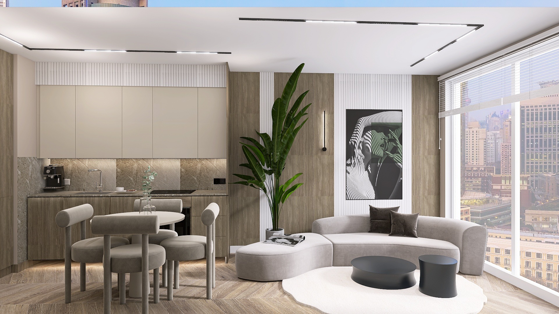 Nowoczesne wnętrze mieszkania z aneksem kuchennym, okrągłym stołem i krzesłami, sofą modułową, rośliną doniczkową i widokiem na miasto za oknem.