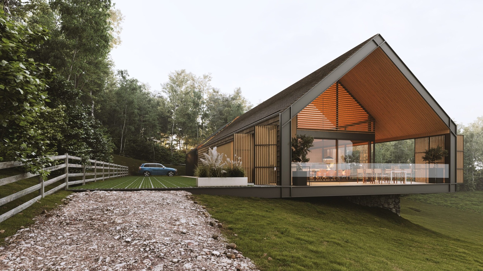 Nowoczesny dom jednorodzinny z przeszkleniami i drewnianą elewacją, usytuowany na wzgórzu, z widocznym podjazdem i samochodem osobowym w tle.