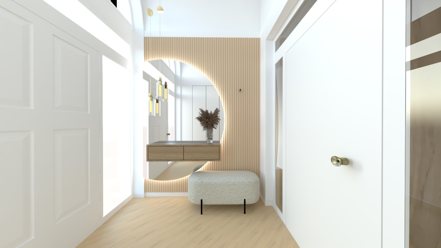 Wnętrze przedpokoju z toaletką z szufladami, okrągłym podświetlanym lustrem i puszystym siedziskiem na czarnych nóżkach, całość w jasnej kolorystyce z elementami drewna.