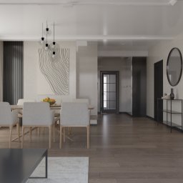 NATALIA MACKO Studio Wymiar Architektura Wnętrz - Jasne, przestronne wnętrze z drewnianą podłogą, stołem jadalnym z owocami, minimalistycznym oświetleniem, nowoczesną grafiką na ścianie i zabudową kuchenną z piekarnikiem marki Bosch.