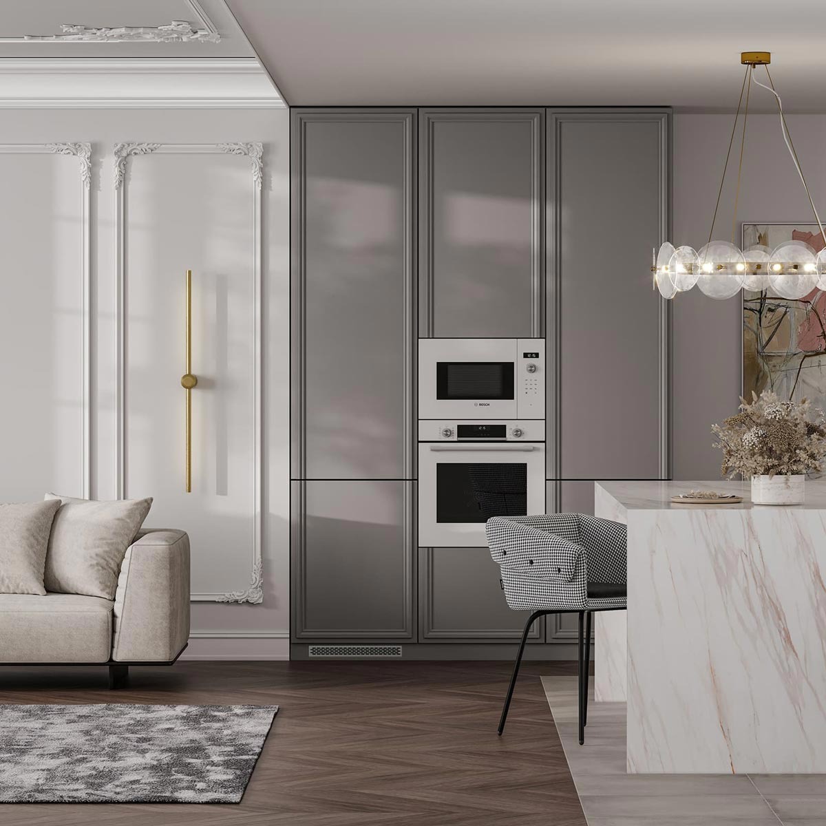Elegancka kuchnia z szarymi szafkami, wbudowanym piekarnikiem i mikrofalówką marki Bosch, marmurowym blatem wyspy, designerskim oświetleniem i dekoracyjną sztukaterią na ścianach.