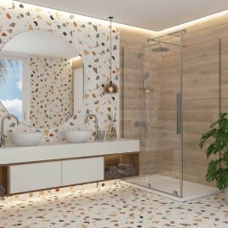 Viktor Nenakhov - Nowoczesna łazienka z podwójną umywalką nablatową, okrągłym lustrem, kabiną prysznicową ze szklanymi drzwiami i mozaikową okładziną ścian oraz podłogi.