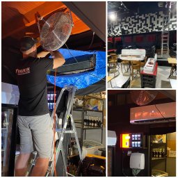 Kovrilo - Mężczyzna na drabinie w czarnej koszulce z logo Daikin serwisuje jednostkę klimatyzacyjną w lokalu komercyjnym, zabezpieczoną niebieską folią, z wentylatorem pomocniczym i półkami z napojami w tle.