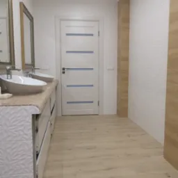 Jasna łazienka po remoncie z podwójną umywalką nablatową, mozaikowym blatem, białą teksturowaną ścianą, drewnopodobnymi płytkami podłogowymi i białą stolarką drzwiową z poziomymi paskami.