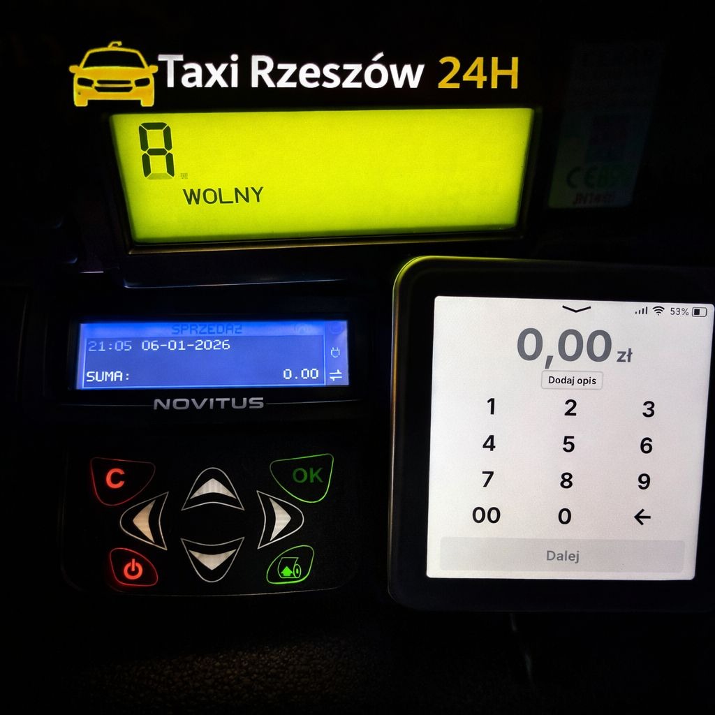 Taksometr z napisem 'Wolny' i panelem dotykowym z kwotą 0,00 zł w taksówce Taxi Rzeszów 24H. Widoczny panel sterowania Novitus.