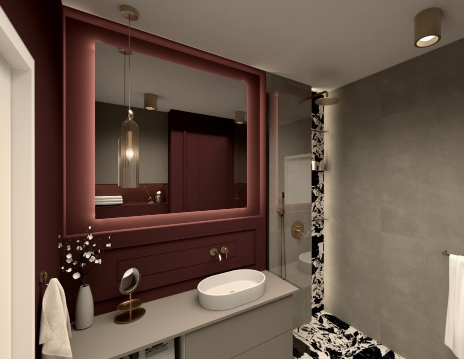 Elegancka łazienka z dużym, podświetlanym lustrem w bordowej ramie, minimalistyczną umywalką i akcentami złota. Marmurowa mozaika w kabinie prysznicowej.