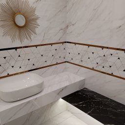 GRUPA FLEXIBLE SPÓŁKA Z OGRANICZONĄ ODPOWIEDZIALNOŚCIĄ - Nowoczesna łazienka z marmurowymi płytkami, umywalką nablatową i lustrem w kształcie słońca. Dekoracyjny pas z geometrycznym wzorem podkreślony złotymi listwami. Podświetlona półka z czarnym marmurem.