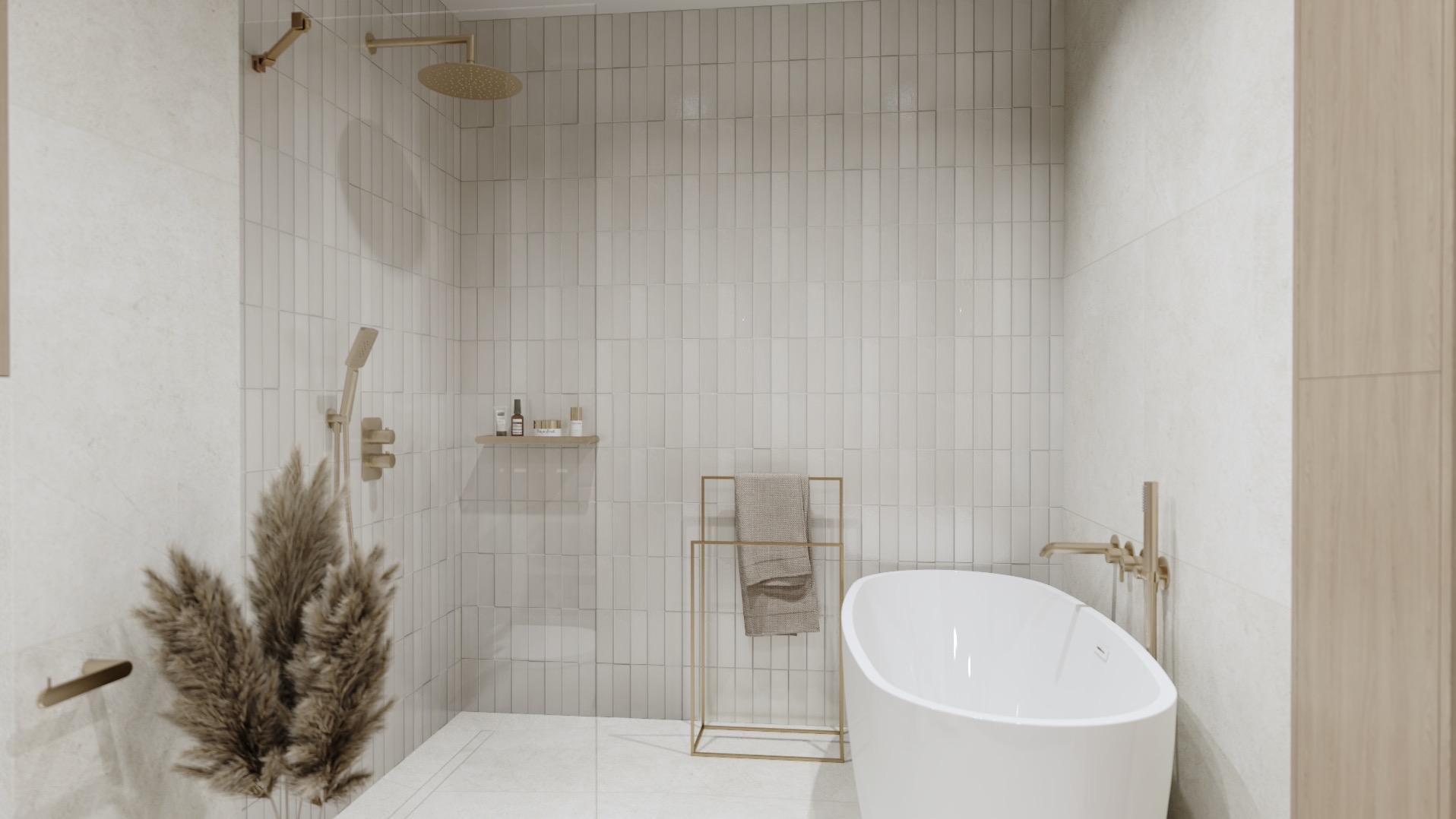 Nowoczesna łazienka z wolnostojącą białą wanną, złotą armaturą, pionowymi białymi płytkami i dekoracyjną trawą pampasową w rogu.