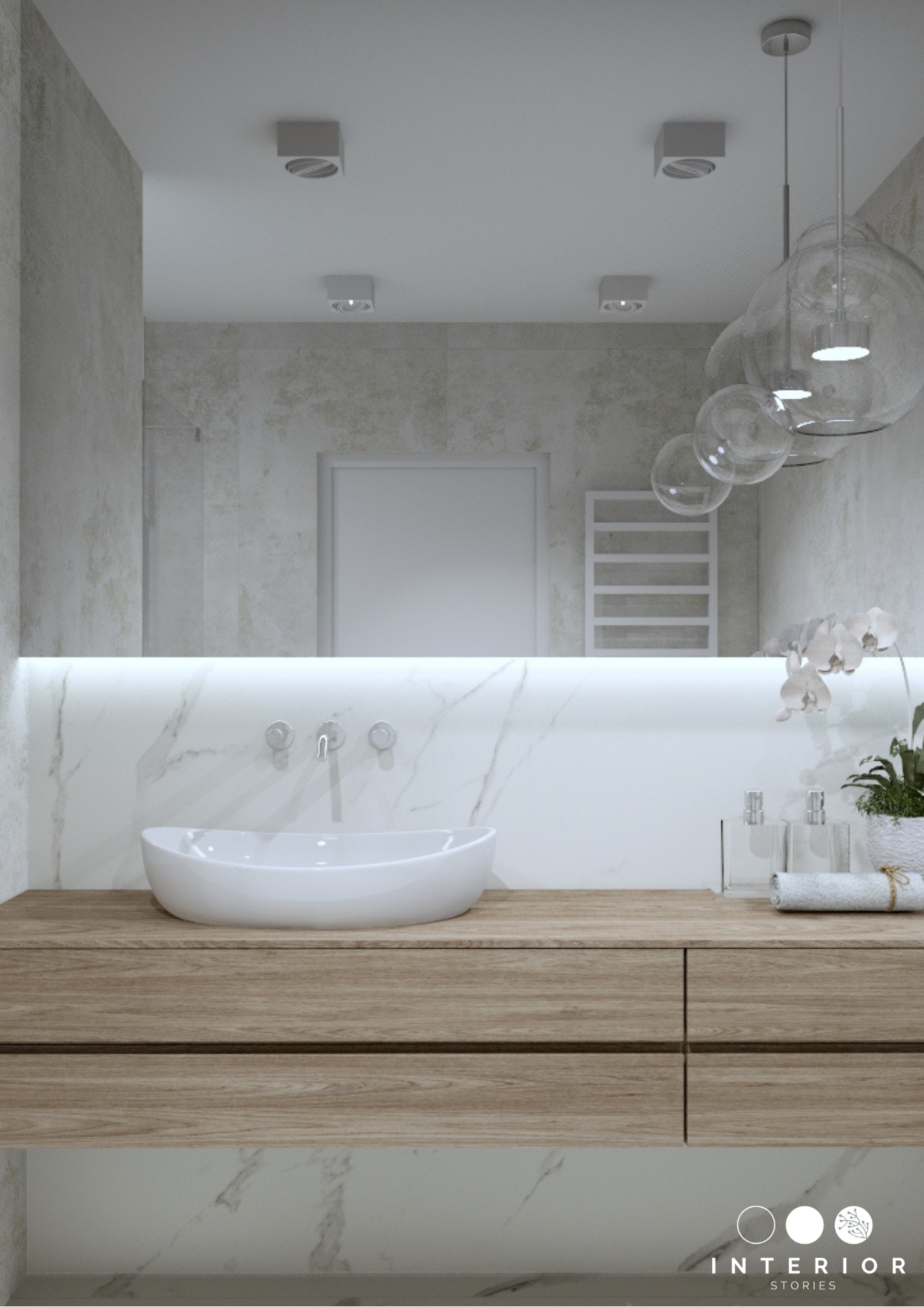 Nowoczesna łazienka z owalną umywalką nablatową, drewnianą szafką pod umywalką, marmurową ścianą z podświetleniem LED, lustrem, szklanymi lampami wiszącymi i grzejnikiem drabinkowym w tle.