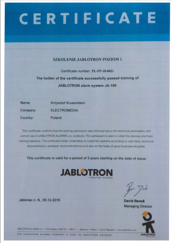 Certyfikat ukończenia szkolenia Jablotron Poziom 1 dla Krzysztofa Krusensterna z firmy Electromedia, potwierdzający wiedzę z zakresu systemu alarmowego JA-100.