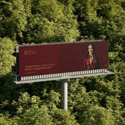 Kameleon Design Arkadiusz Kątny - Billboard z wizerunkiem prawniczki na tle zieleni, z hasłem reklamowym i adresem strony internetowej.