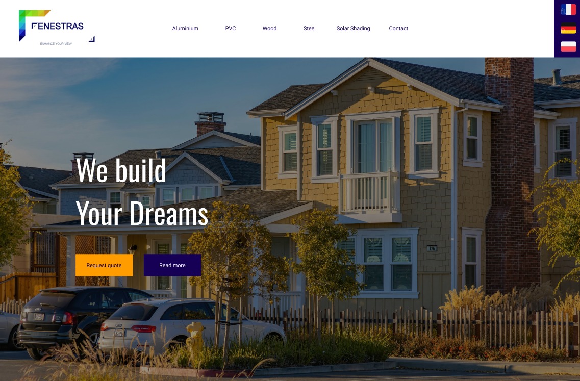 Żółty dom szeregowy z białymi oknami, widoczny z ulicy z zaparkowanymi samochodami, prezentowany na stronie internetowej firmy budowlanej z hasłem 'We build Your Dreams'.