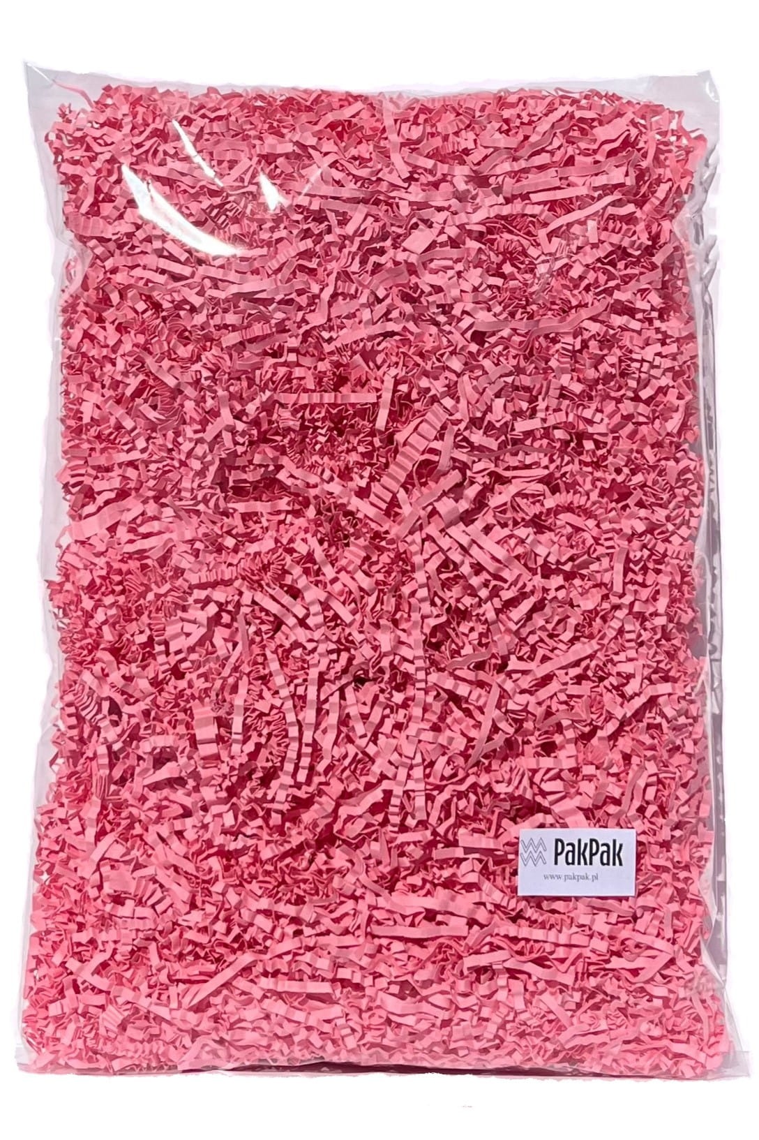 Przezroczysta torba wypełniona różowym, pociętym papierem dekoracyjnym, z widocznym logo firmy PakPak w prawym dolnym rogu.