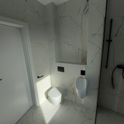 Oleksandr Turchynskyi - Nowoczesna łazienka z białymi płytkami imitującymi marmur, wiszącą toaletą i pisuar oraz czarnymi akcentami w postaci armatury i uchwytów, widoczne przewody elektryczne w górnym rogu.