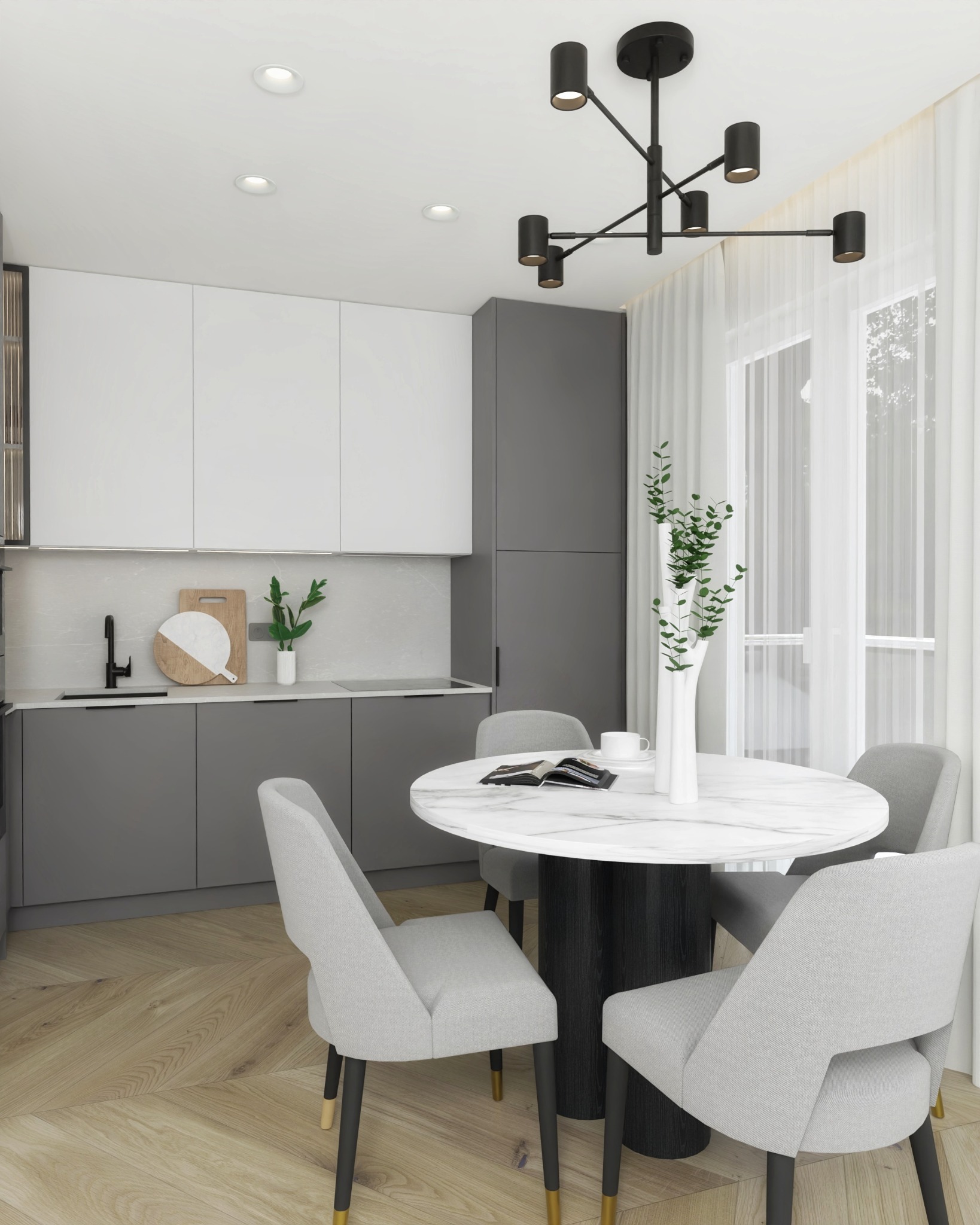 Nowoczesna kuchnia z szarymi i białymi szafkami, okrągłym marmurowym stołem jadalnym, szarymi krzesłami z czarnymi nogami zakończonymi złotymi detalami, minimalistycznym czarnym żyrandolem...
