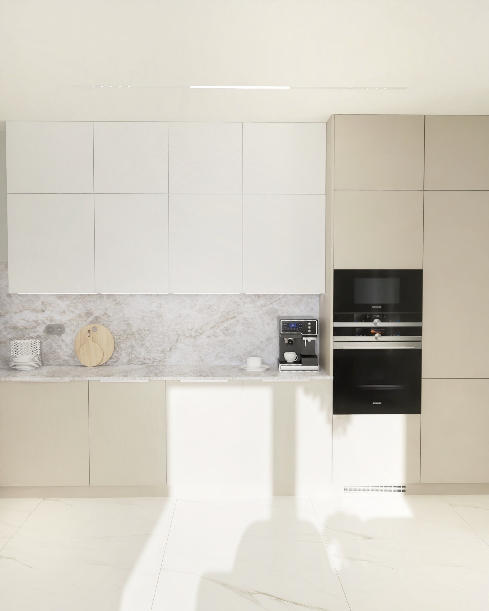 Jasna kuchnia z marmurowym blatem, zabudową w odcieniach beżu i bieli, oraz wbudowanym piekarnikiem Siemens. Na blacie ekspres do kawy i akcesoria.