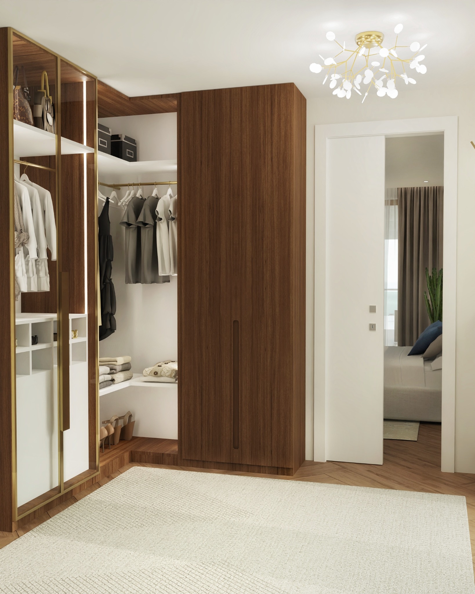 Nowoczesna garderoba z drewnianym wykończeniem i złotymi akcentami, oświetlona dekoracyjną lampą. Widok na sypialnię przez uchylone drzwi.