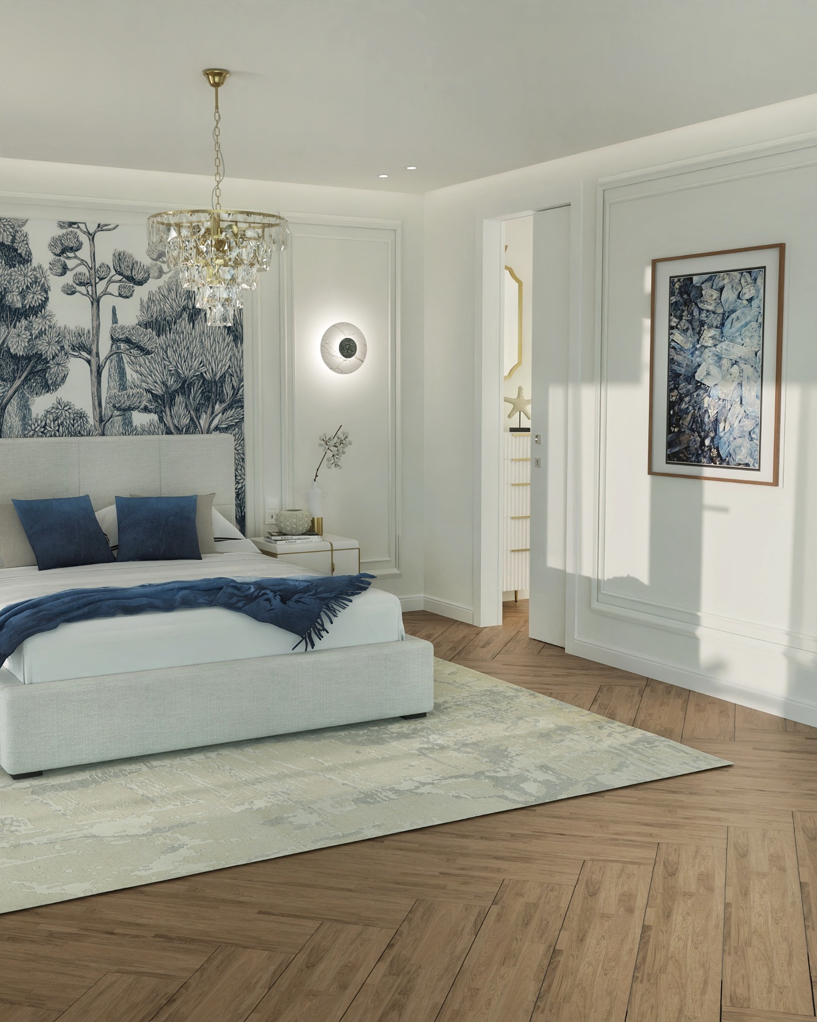 Jasna sypialnia z łóżkiem, niebieskimi poduszkami i pledem. Na ścianie tapeta w drzewa, obok lampka i obraz. Na podłodze parkiet i dywan.