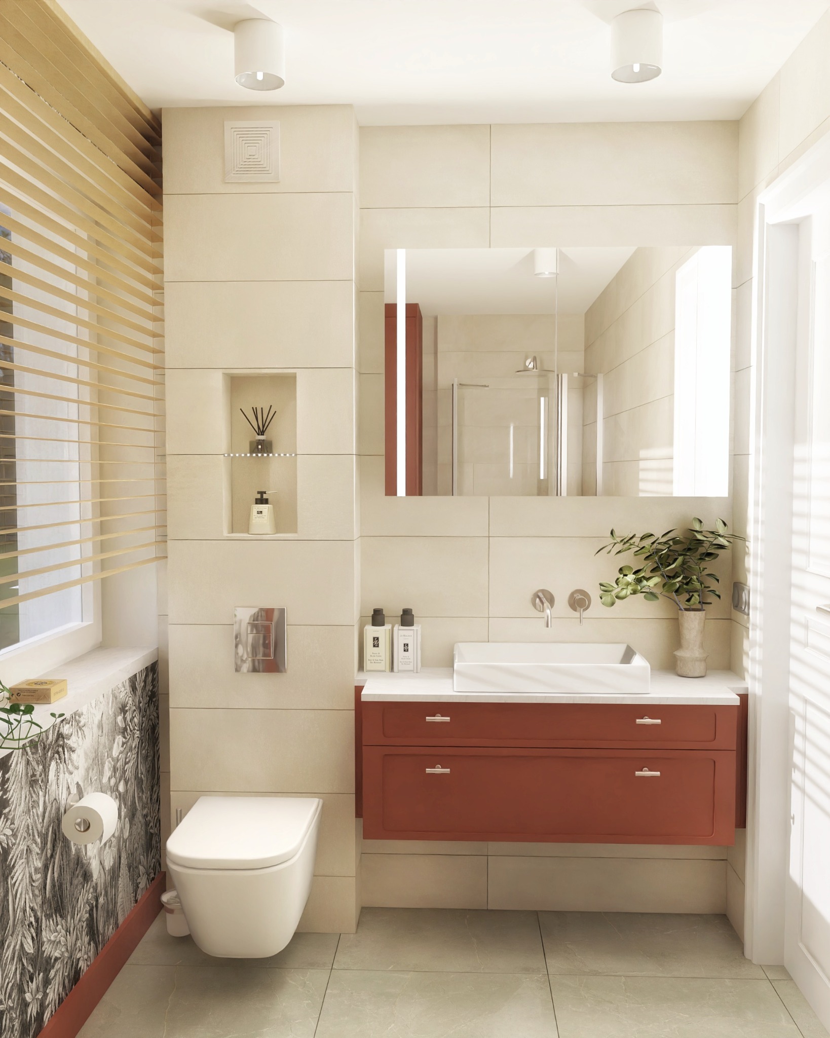 Jasna łazienka z akcentami terakoty: szafka pod umywalką i listwa przypodłogowa. Na ścianie oryginalna tapeta z motywem roślinnym, a w lustrze odbicie kabiny prysznicowej.