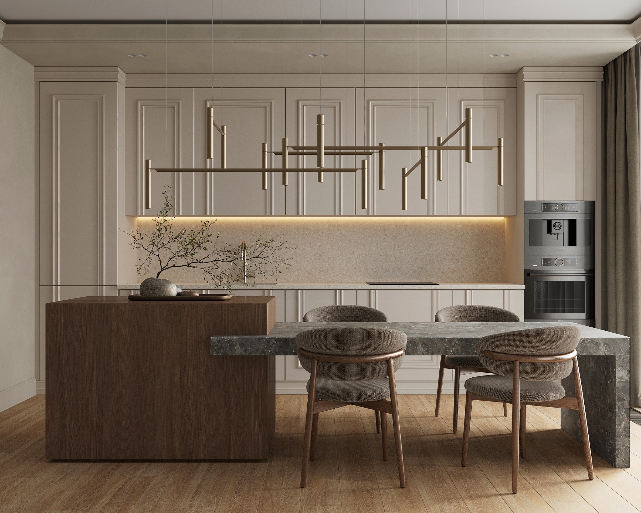 Elegancka kuchnia w neutralnych barwach z wyspą i stołem z kamiennym blatem, oświetlona nowoczesną lampą wiszącą, z minimalistyczną dekoracją z gałązek w kamiennej misie.