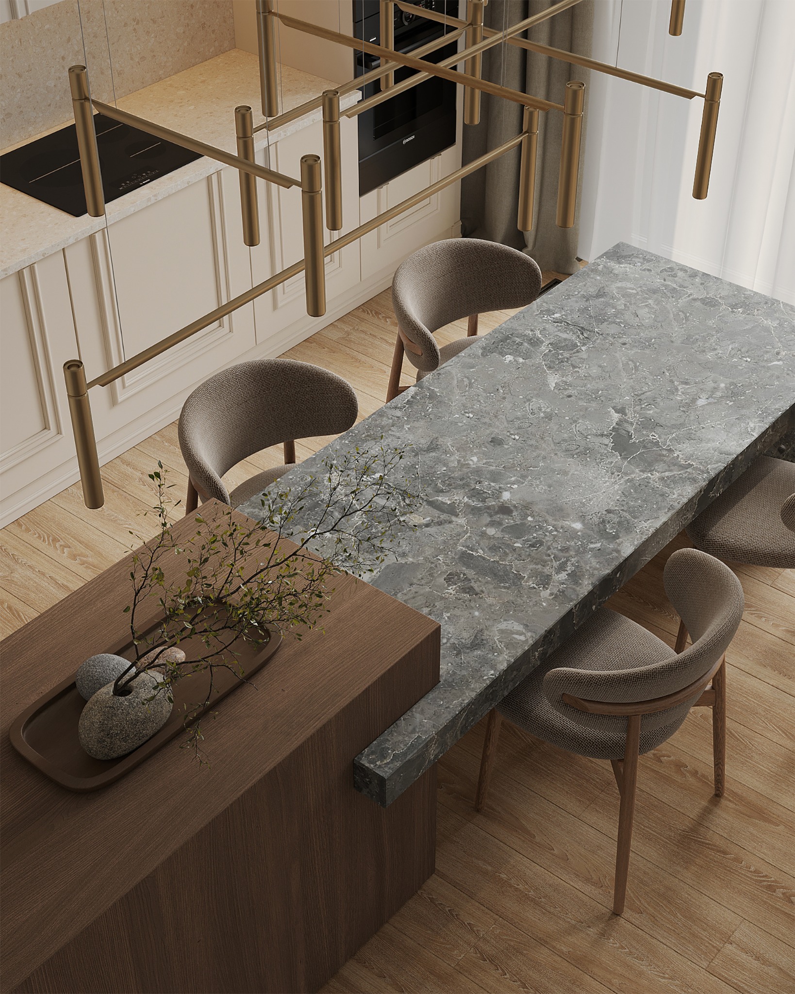 Wnętrze jadalni z blatem z szarego marmuru, drewnianym stołem z dekoracją z gałązek i kamieni oraz złotą lampą sufitową.