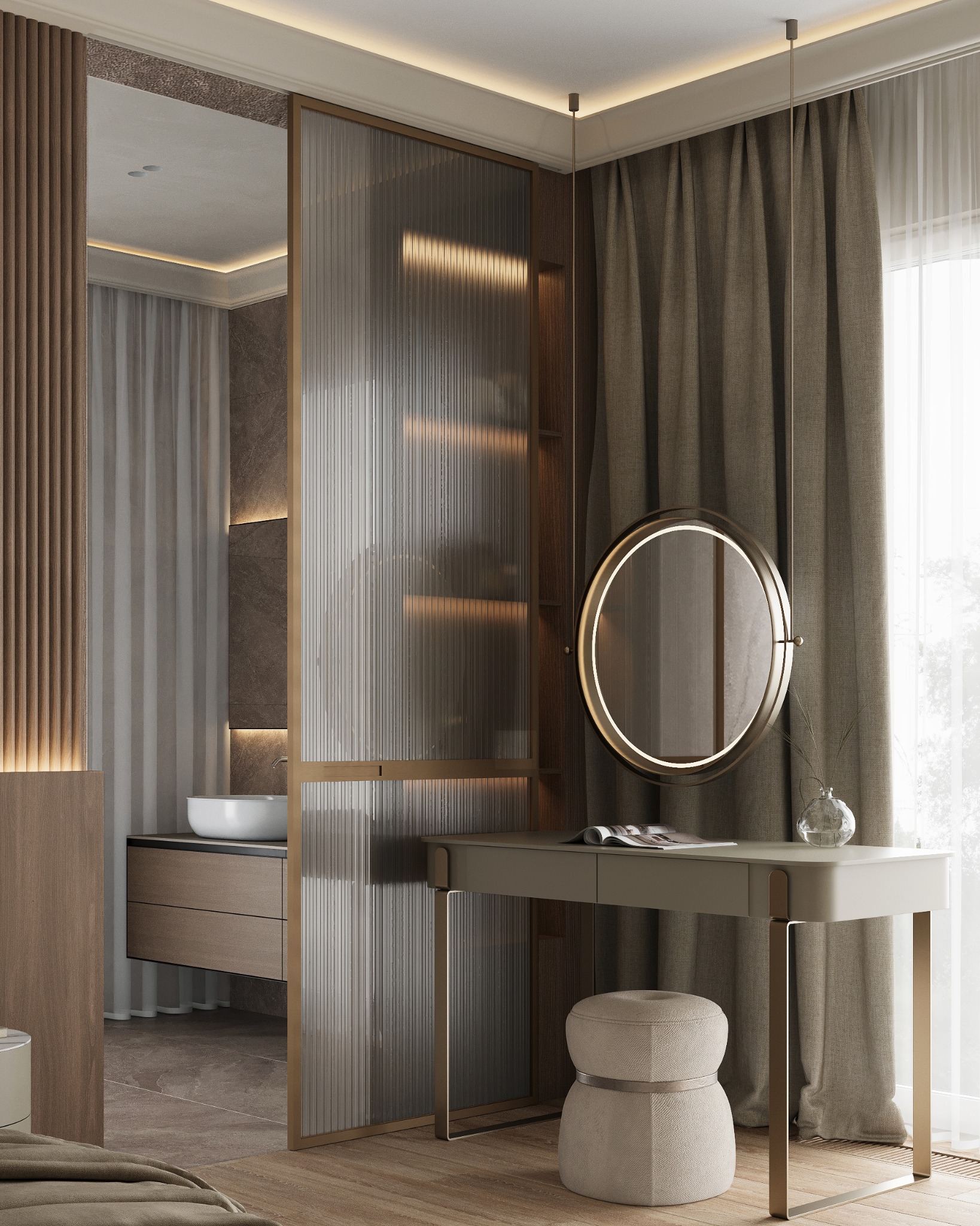 Elegancka toaletka z okrągłym lustrem podświetlanym LED, obok stołek tapicerowany, w tle łazienka oddzielona szklaną ścianką z ryflowanego szkła, całość w stonowanej kolorystyce.