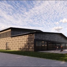 PKBG SPÓŁKA Z OGRANICZONĄ ODPOWIEDZIALNOŚCIĄ - Wizualizacja zewnętrzna nowoczesnej hali z elewacją w odcieniach brązu i czerni, z widocznymi żaluzjami okiennymi i przesuwnymi bramami, zarys postaci ludzkich na tle budynku, rowerzysta na ścieżce...