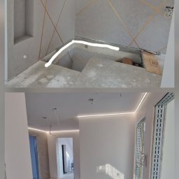 BIPI-BUD Bartłomiej Pazdro - Surowy stan wnętrza z szarymi ścianami zdobionymi złotymi, geometrycznymi liniami, podświetlonymi listwami LED na suficie i wnęką w ścianie, ukazujący etap prac wykończeniowych.