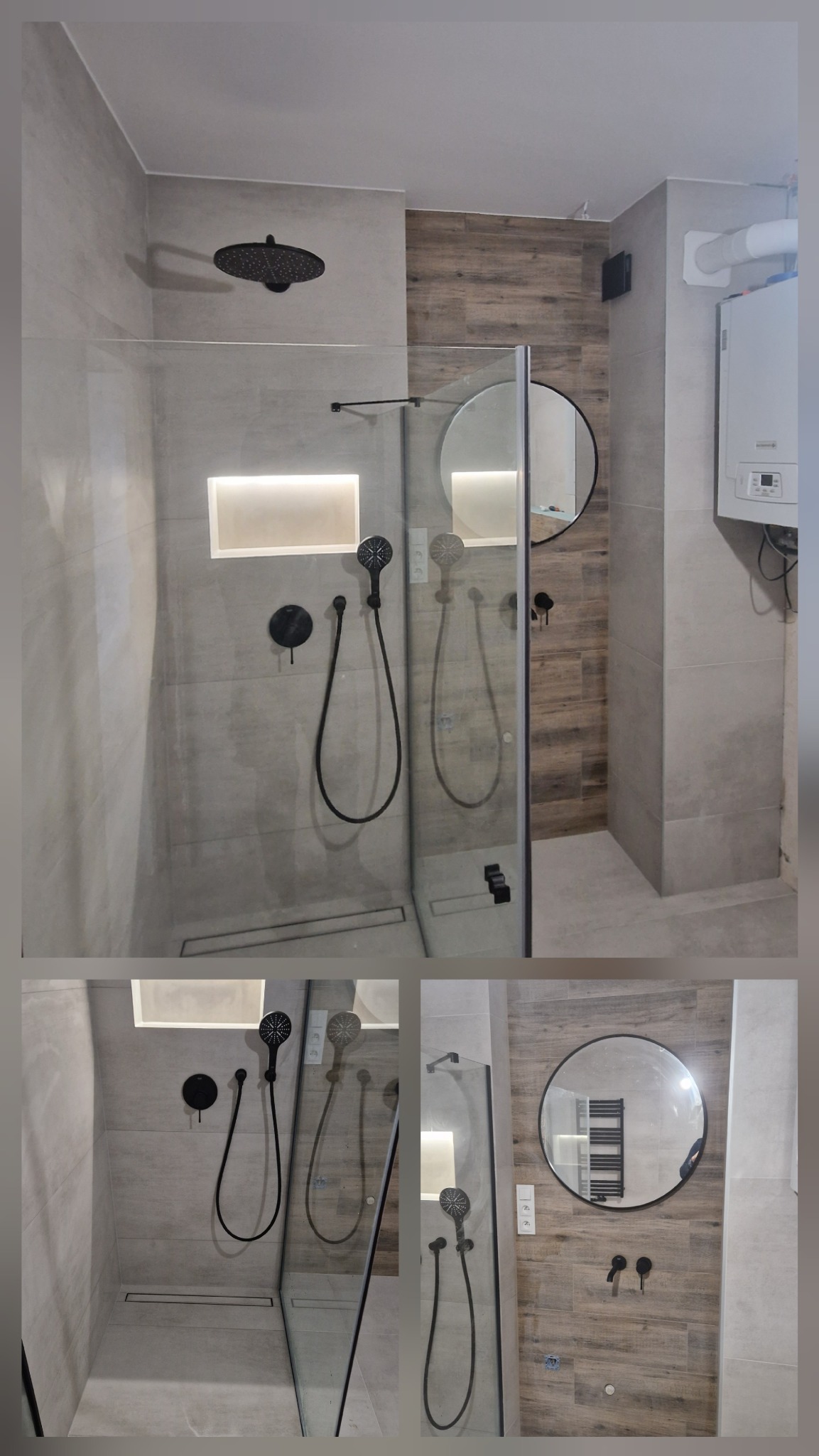Nowoczesna kabina prysznicowa z czarną armaturą, szklaną ścianką i odpływem liniowym, oświetlona wnęka w szarej płytce, okrągłe lustro na ścianie z drewnopodobnych płytek, widoczny bojler.