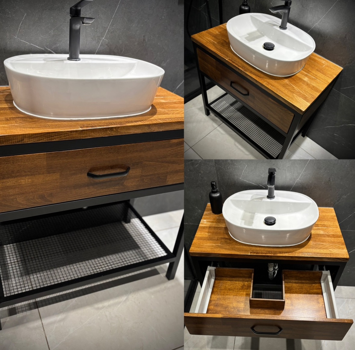 Nowoczesna umywalka nablatowa owalna na szafce z drewnianym blatem i czarną metalową ramą, widoczne otwarte szuflady i półka z metalowej siatki, czarna bateria, szara płytka na ścianie i podłodze.