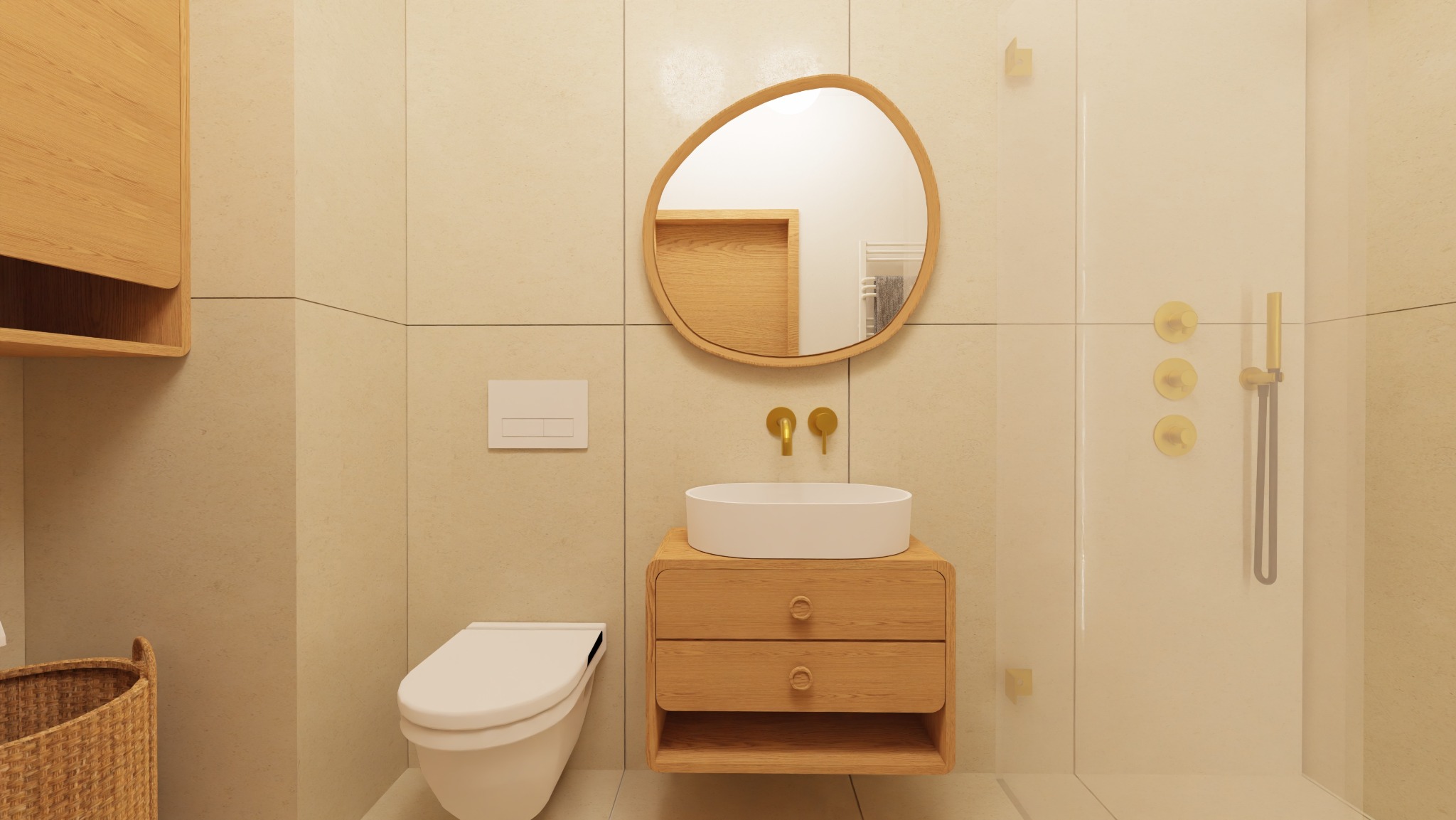 Jasna łazienka w ciepłych tonach z drewnianymi akcentami: owalne lustro, umywalka na szafce, toaleta i kabina prysznicowa z złotą armaturą.
