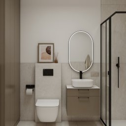 invero studio - Nowoczesna łazienka w beżach: podwieszana toaleta, umywalka z szafką, owalne lustro z podświetleniem i kabina prysznicowa z czarnymi ramami. Minimalistyczny design.