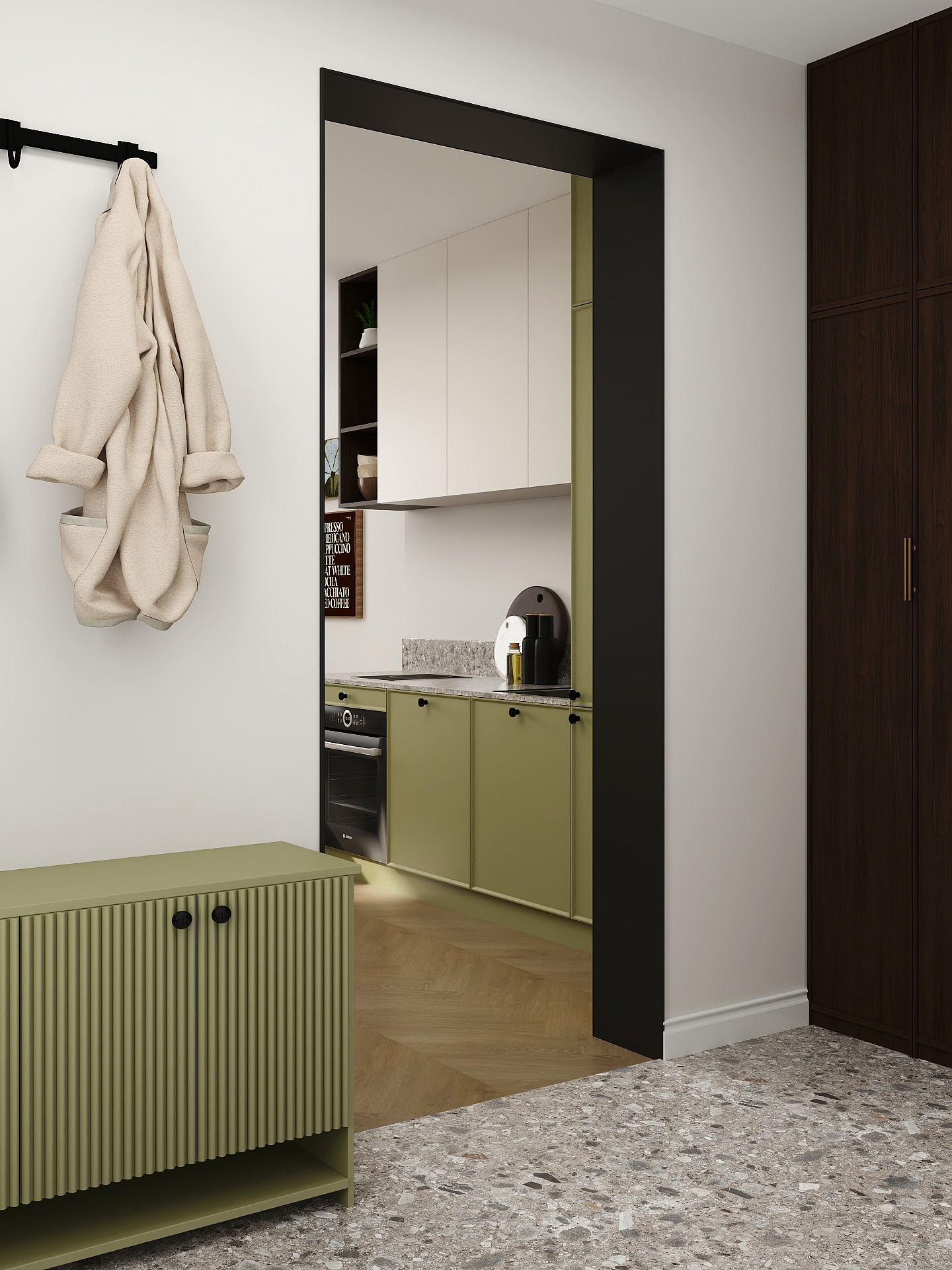 Nowoczesne wnętrze: zielona szafka, wieszak z płaszczem i widok na kuchnię z oliwkowymi szafkami przez czarną futrynę. Uwagę przykuwa kontrast faktur podłogi.