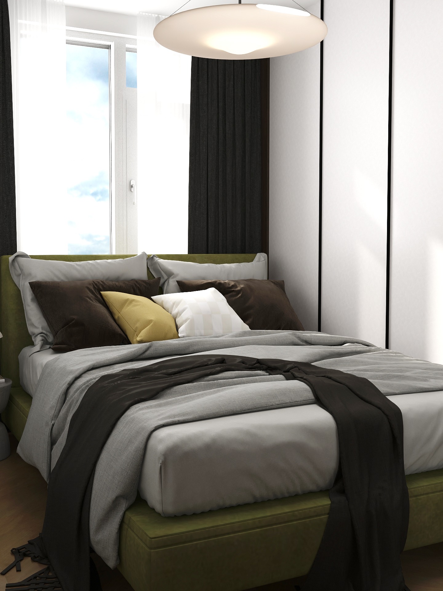 Nowoczesna sypialnia z łóżkiem w odcieniach zieleni i szarości, z czarną narzutą i białymi szafami w tle, oświetlona okrągłą lampą sufitową.