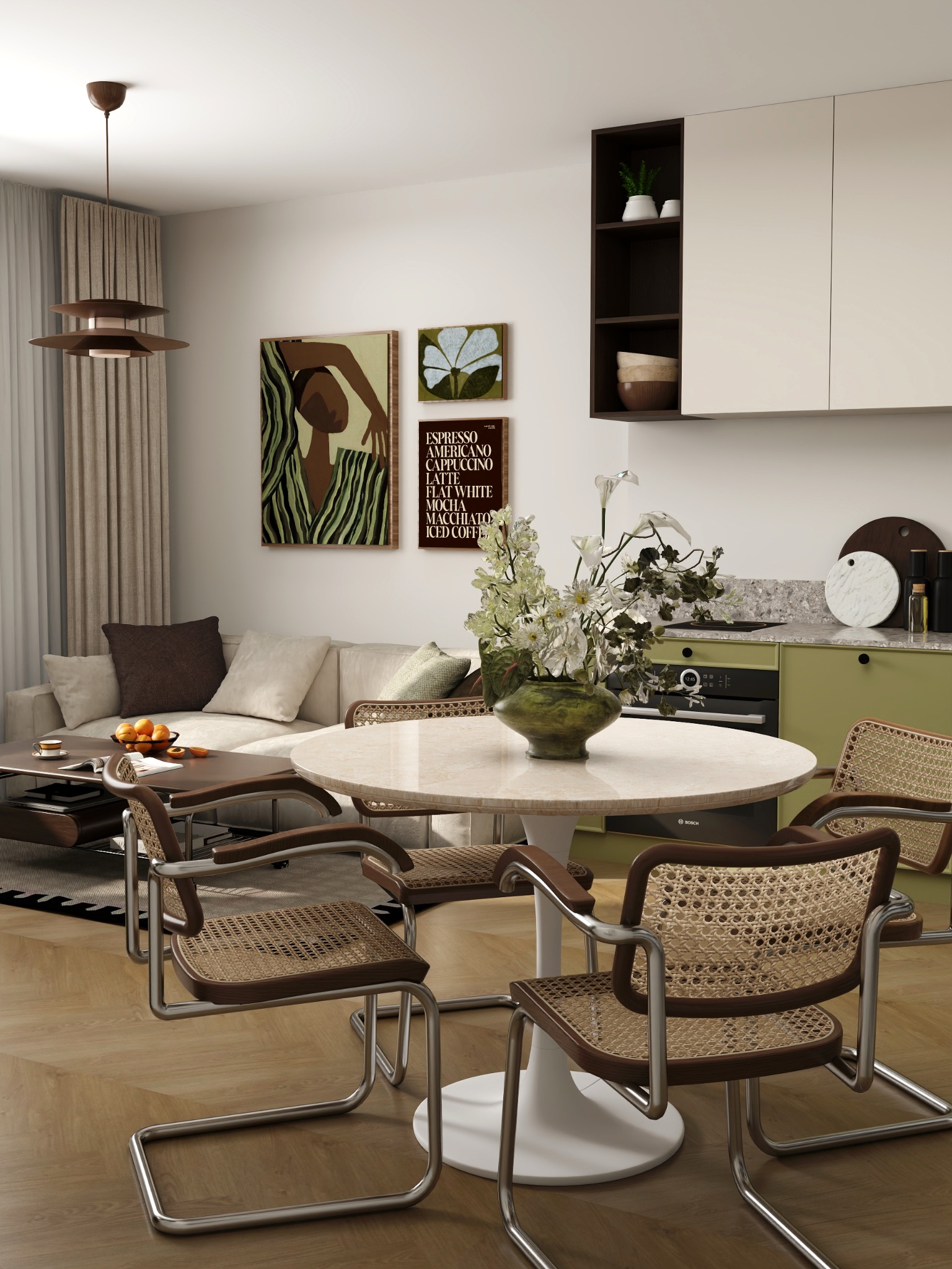Jasne wnętrze z okrągłym stołem, krzesłami z rattanu i zieloną zabudową kuchenną. Na ścianie wiszą obrazy, a całość dopełnia drewniana podłoga.
