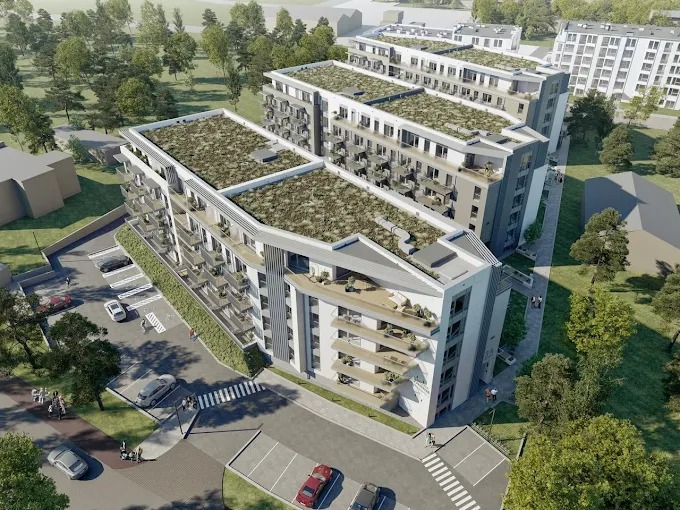 Wizualizacja osiedla z zielonymi dachami i balkonami, widok z lotu ptaka. Nowoczesna architektura wkomponowana w otoczenie zieleni miejskiej. Parking przed budynkami.