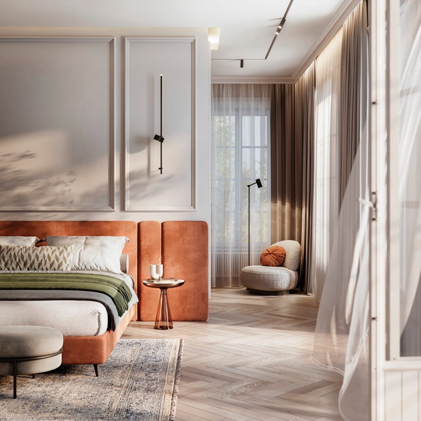 Nowoczesna sypialnia w odcieniach beżu i pomarańczy z łóżkiem z welurowym zagłówkiem, parkietem w jodełkę i minimalistyczną lampą ścienną.