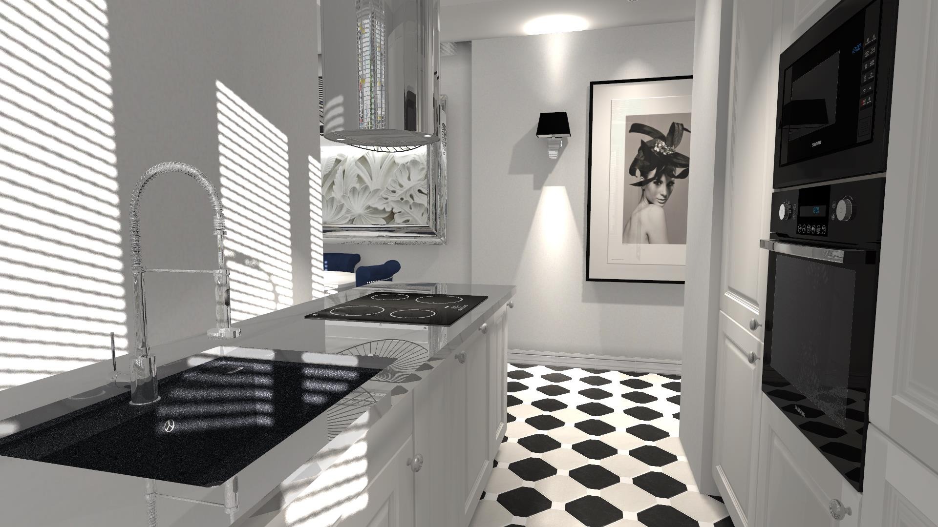 Wnętrze nowoczesnej, jasnej kuchni w Sopocie z czarnym blatem, chromowaną baterią, płytą indukcyjną i piekarnikiem w zabudowie, uzupełnione czarno-białą podłogą i portretem na ścianie.