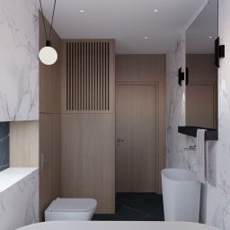 Inovo Design Studio - Wizualizacja łazienki z marmurowymi ścianami, drewnianymi szafkami i czarną podłogą. Umywalka wolnostojąca i wisząca toaleta. Minimalistyczna lampa wisząca.