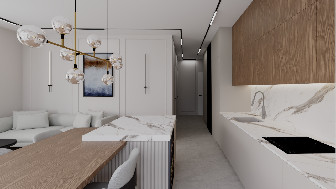 Nowoczesne wnętrze: biała kuchnia z drewnianymi szafkami, marmurowym blatem i wyspą z drewnianym blatem, oświetlona designerską lampą.