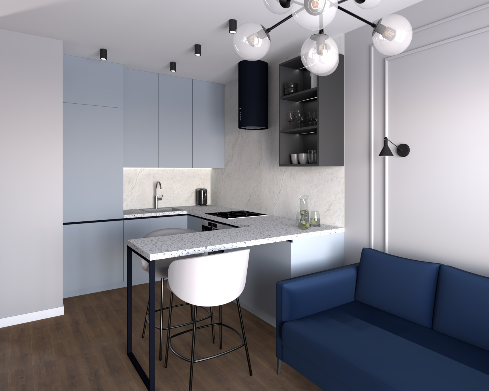 Nowoczesna kuchnia z niebieskimi szafkami, blatem w kropki i ciemnym okapem. Widoczny fragment salonu z niebieską sofą i designerską lampą sufitową.