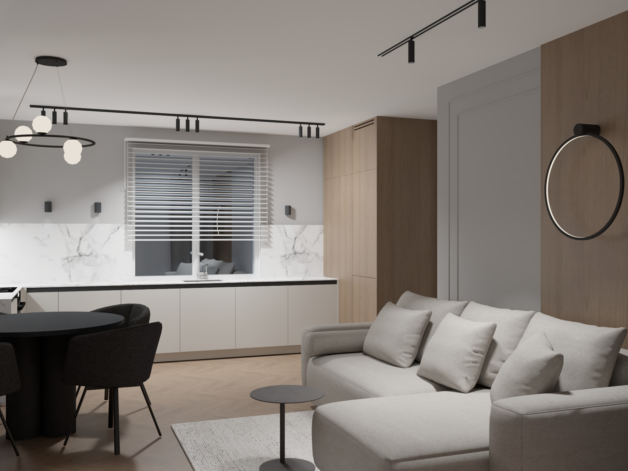Nowoczesne wnętrze: jasna kuchnia z marmurowym blatem, okrągły stół z krzesłami i szara sofa z poduszkami. Minimalistyczne oświetlenie punktowe i dekoracyjne.