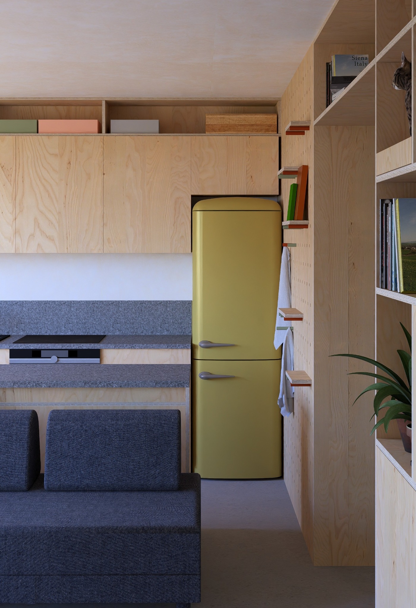 Wnętrze kuchni w bloku z żółtą lodówką retro i drewnianą zabudową. Minimalistyczny design z rośliną doniczkową na regale i szarą sofą w tle.