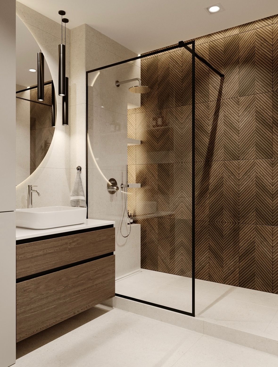 Nowoczesna łazienka z kabiną typu walk-in, umywalką nablatową na drewnianej szafce i okrągłym lustrem. Ściana wyłożona płytkami w jodełkę. Minimalistyczny design.