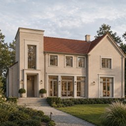 DREAMSPACE HOLDING - GRUPA KAPITAŁOWA SPÓŁEK PROJEKTOWYCH - CAŁA POLSKA - Elegancki dom z jasnej cegły i czerwonym dachem, z wysokim oknem nad wejściem, oświetlonym wnętrzem. Brukowana ścieżka prowadzi przez zadbany ogród z sosnami w tle.