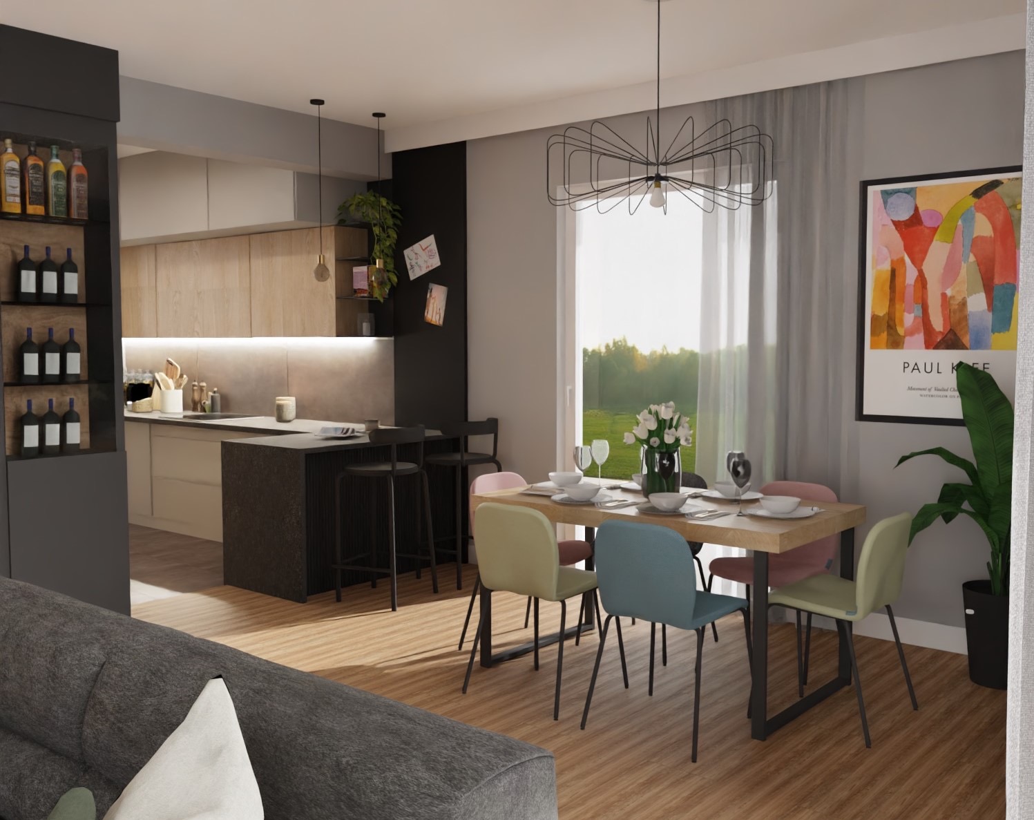 Wnętrze jadalni z drewnianym stołem, krzesłami w pastelowych kolorach i wyspą kuchenną z hokerami. Na ścianie plakat Paula Klee. Nowoczesny design, jasne kolory.